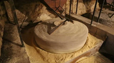 Millstone in a watermill grinds corn  6 of 7 Stock Footage 54630590