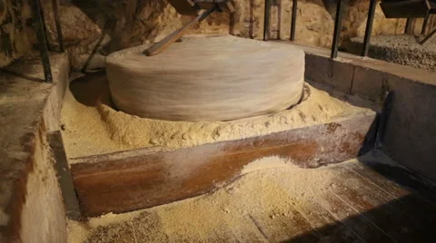 Millstone in a watermill grinds corn  7 of 7 Stock Footage 54634696