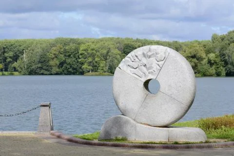 A millstone wheel was installed on the left bank of the Svisloch River in mem Stock Photos