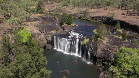 Millstream Falls waterfall backward aerial in Atherton Tablelands, Video stock 195998621