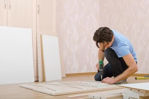 Millwright gathers wardrobe Stock Photos