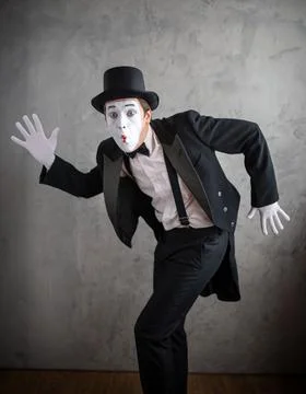 Mime actor in dynamic running pose with an astonished expression Stock Photos