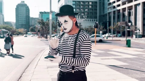 Mime, angry and problem with smartphone in city for technical glitch, error and 库存影片 270870053