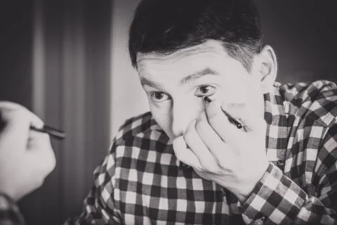 Mime applying make-up Stock Photos
