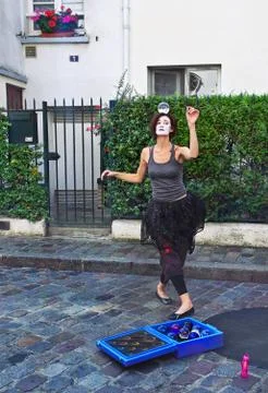 Mime dancing with a magic ball on the head in Montmartre, Paris, France. Stock Photos