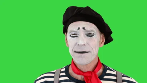 Mime doing different emotions from smiling to being sad on a Green Screen Stock Footage 138543096