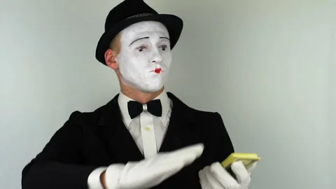 Mime throws money. Full HD Stock Footage 86193602