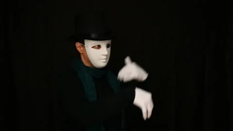 Mime in a white mask-face, hat and white gloves dancing plastically Stock Footage 142720533