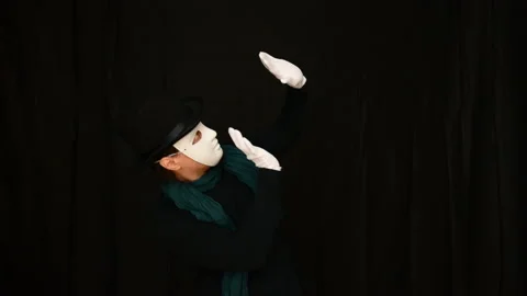 Mime in a white mask-face, hat and white gloves dancing plastically Stock Footage 142721152