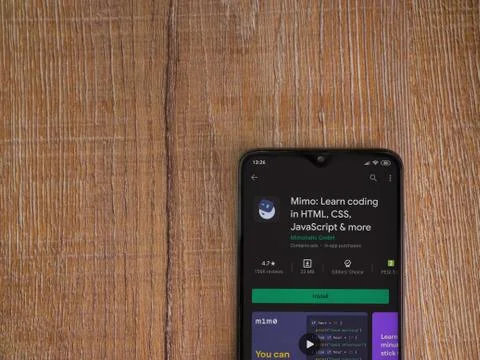 Mimo - Learning coding app play store page on the display of a black mobile s Stock Photos
