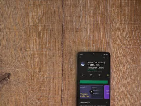 Mimo - Learning coding app play store page on the display of a black mobile s Stock Photos