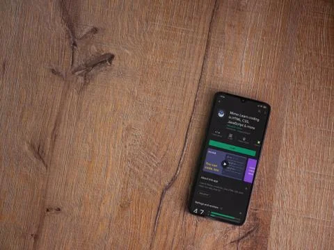 Mimo - Learning coding app play store page on the display of a black mobile s Stock Photos