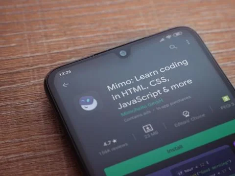 Mimo - Learning coding app play store page on the display of a black mobile s Stock Photos