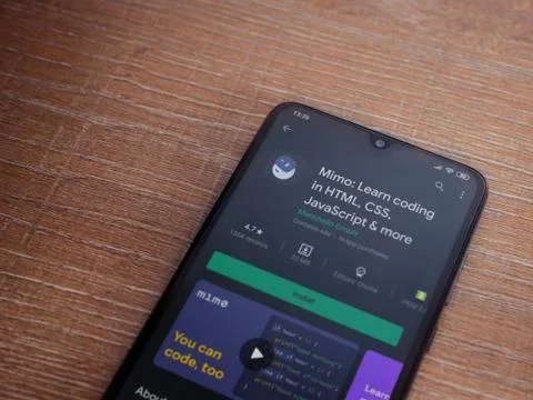 Mimo - Learning coding app play store page on the display of a black mobile s Foto stock