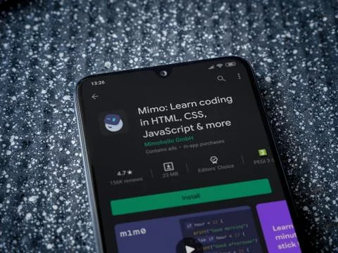 Mimo - Learning coding app play store page on the display of a black mobile s 스톡 사진