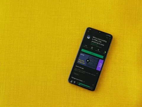 Mimo - Learning coding app play store page on the display of a black mobile s Stock Photos