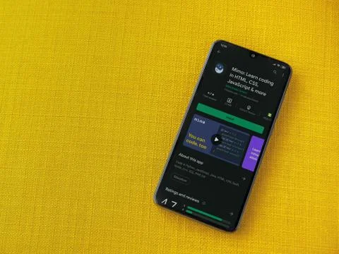 Mimo - Learning coding app play store page on the display of a black mobile s Foto stock