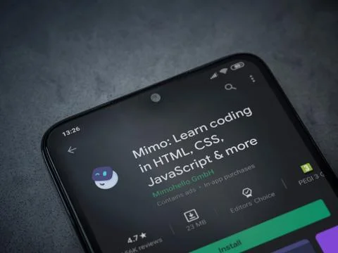 Mimo - Learning coding app play store page on the display of a black mobile s Fotos de archivo