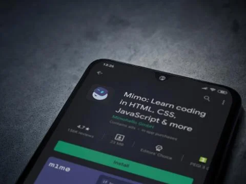 Mimo - Learning coding app play store page on the display of a black mobile s Fotos de archivo