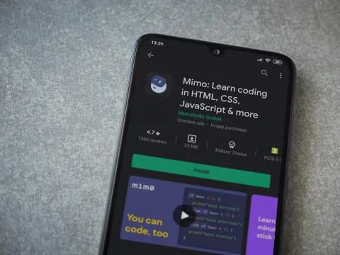 Mimo - Learning coding app play store page on the display of a black mobile s Stock Photos