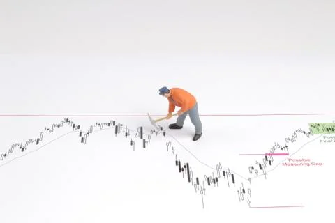 Min worker with pickaxe working on a graph Stock Photos