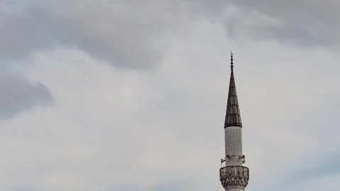 Minaret with clouds in Turkey. Stock Photos