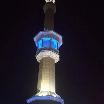 Minaret in front of the mosque Stock Photos