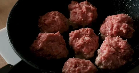 Minced beef patties are fried in a frying pan. 4k video. Stock Footage 272335016