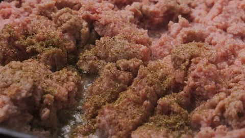 Minced chicken is fried in a frying pan in vegetable oil Stock Footage 296760352