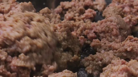 Minced lamb is fried in a frying pan with vegetable oil Stock Footage 313676489