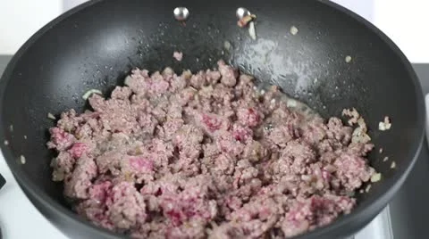 Minced meat being fried in a pan Stock Footage 24671177