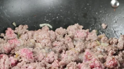 Minced meat being fried in a pan Video stock 24671179