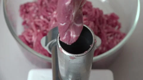Minced Meat being made in the shredder in the kitchen Stock Footage 239674818