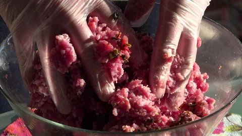Minced Meat being made in the shredder and adding spices in the kitchen Stock Footage 239676741