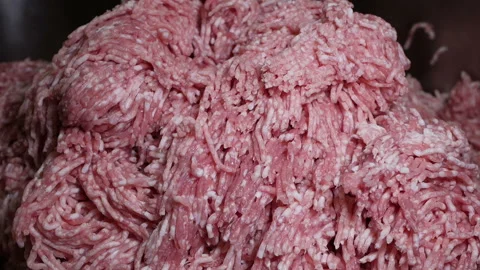 Minced meat is being released by a meat chopping machine Stock Footage 144168054