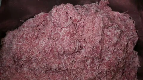 Minced meat is being released by a meat chopping machine Stock Footage 144168193