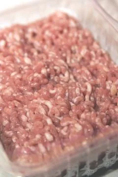 Minced meat in a container Stock Photos