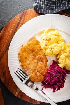 Minced meat cutlet served with mashed potatoes and salad. Stock Photos