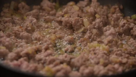 Minced meat in the form of minced meat is fried on a skillet Stock Footage 196322624