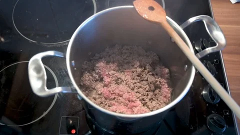 Minced meat is fried in a saucepan Stock Footage 124679511