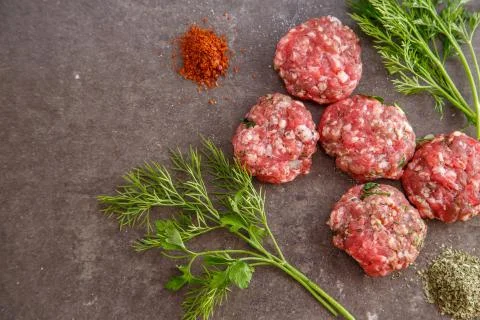 Minced meat on a grey background Stock Photos