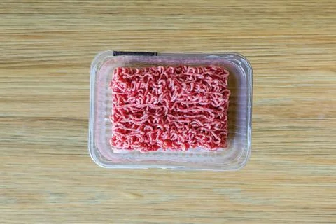 Minced meat in plastic packaging Stock Photos