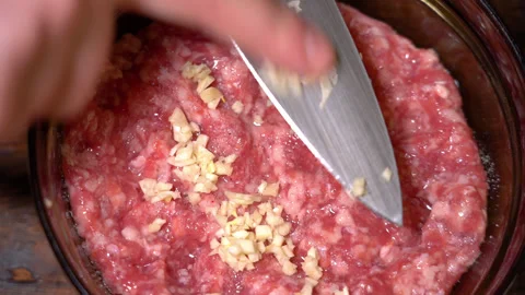 Minced meat in a plate with garlic Stock Footage 252601151