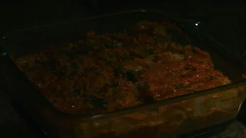 Minced meat stew in cabbage leaves, in the form and on a plate, play with light Stock Footage 153801556
