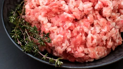 Minced pork. fresh raw minced meat in black cup Stock Footage 144065306