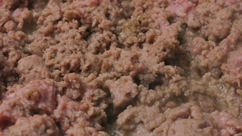 Minced veal is fried in a frying pan in vegetable oil. Medium shot. 库存影片 310206540