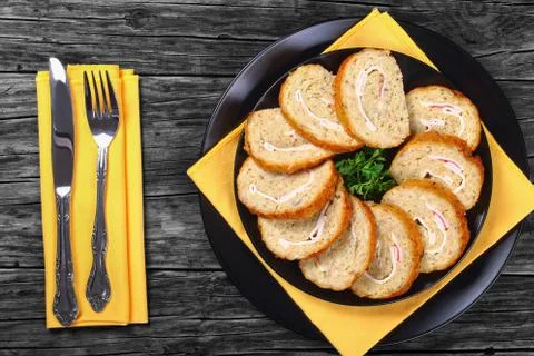 Minced white fish fillets roll-up on plate Stock Photos