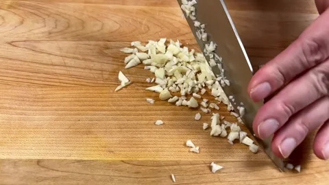 Mincing Garlic Slow Motion Stock Footage 318699560