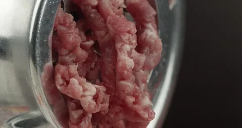 Mincing ground beef with a meat grinder closeup Stock Footage 143309340