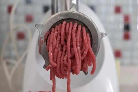 Mincing machine and beef mincing in home environment, Stock Photos